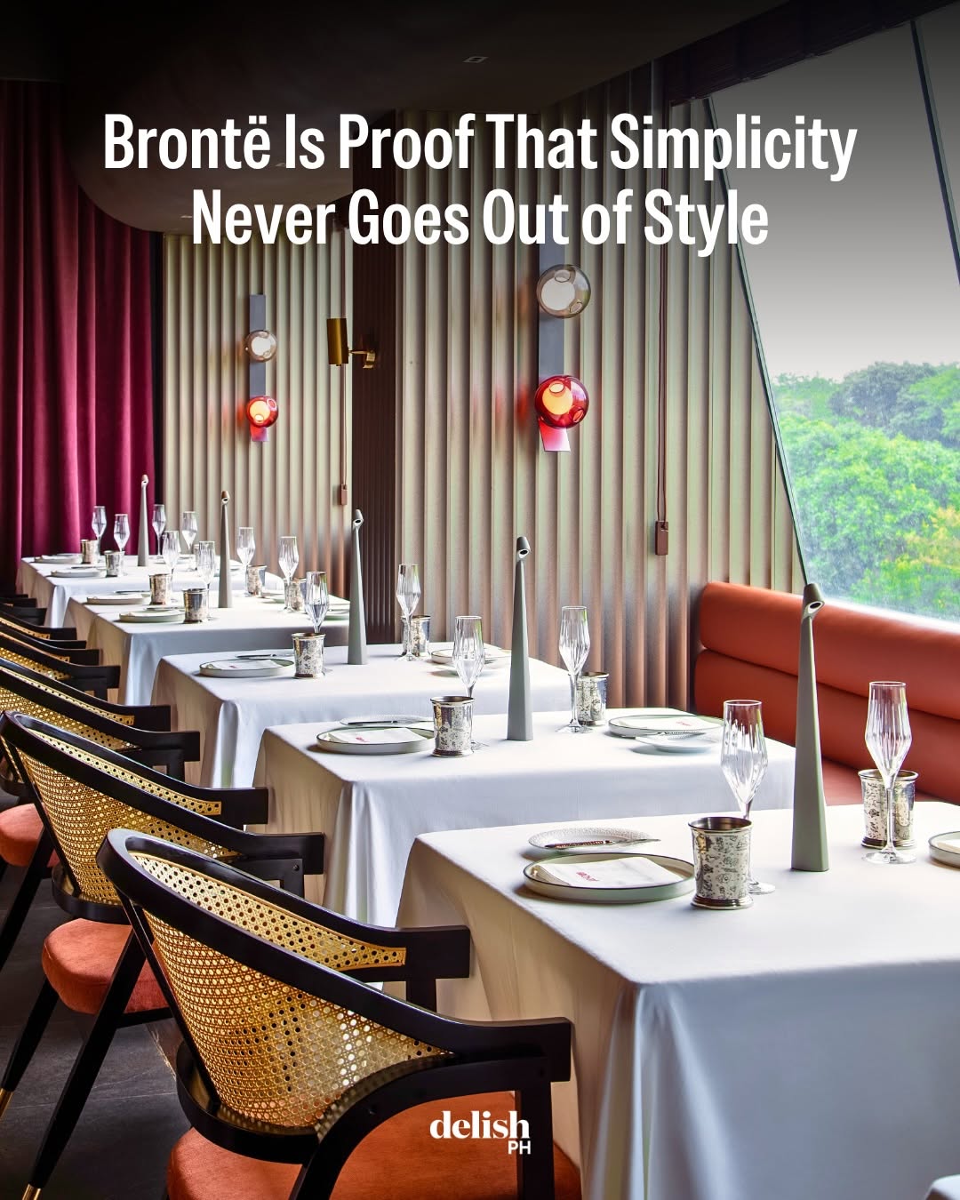 Brontë dining room with white tablecloths and floor-to-ceiling windows